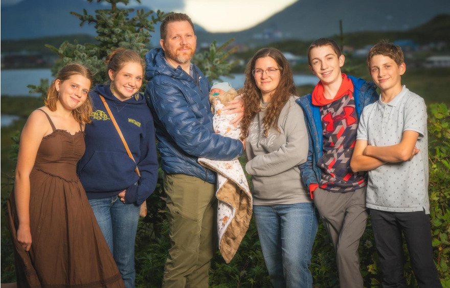Pastor Jacob Whitaker with his wife Beth and their five children outdoors